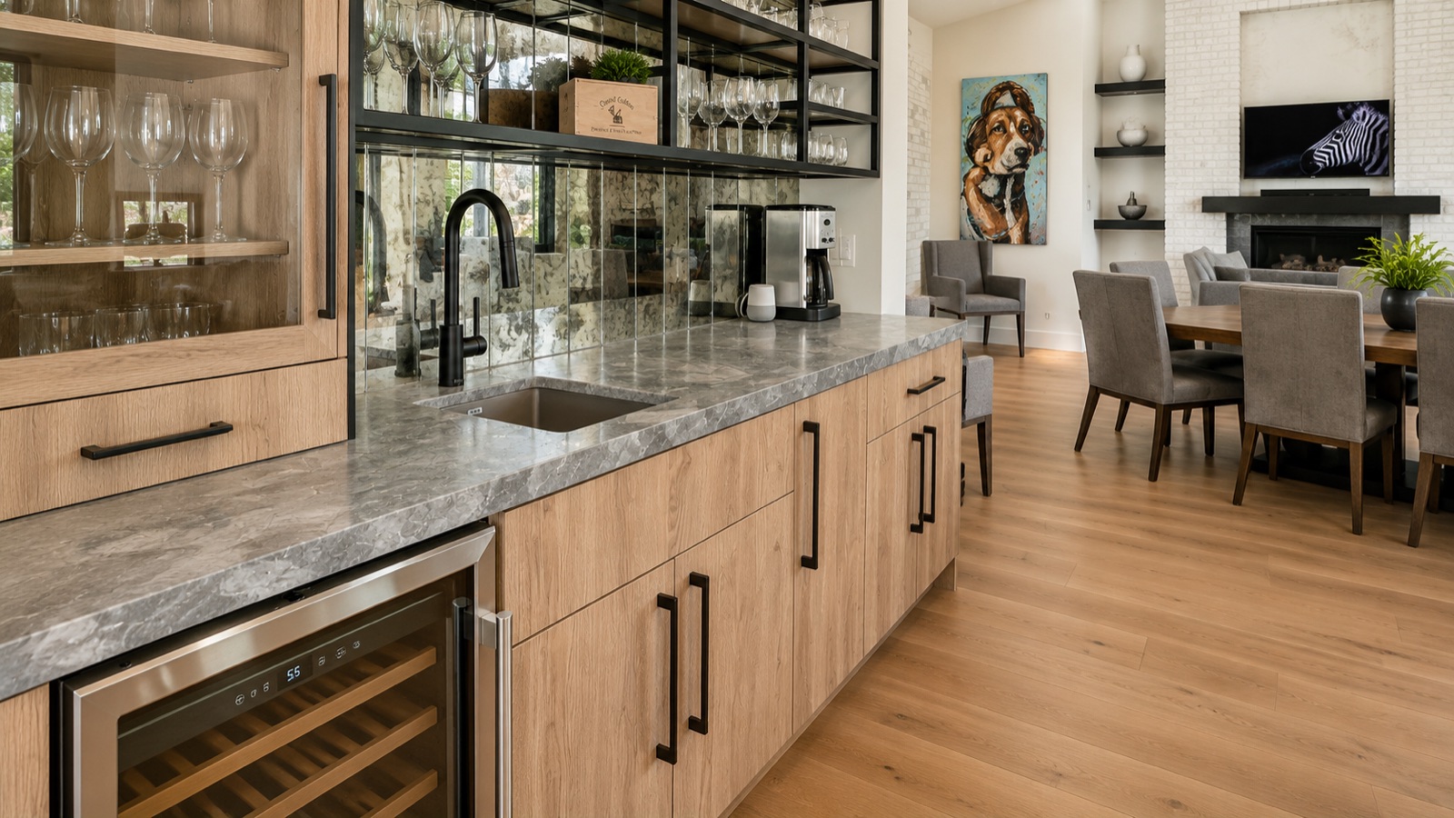Custom coffee bar with wood cabinetry, mirrored tile, and view into dining room