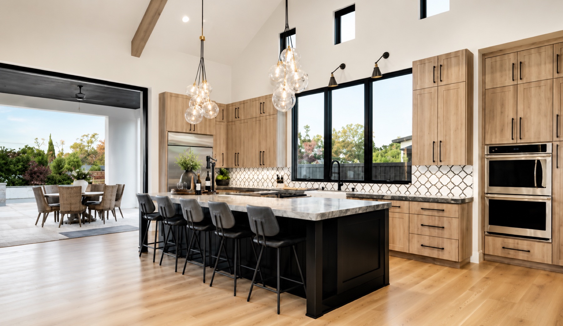 Warm custom kitchen opening to an outdoor terrace
