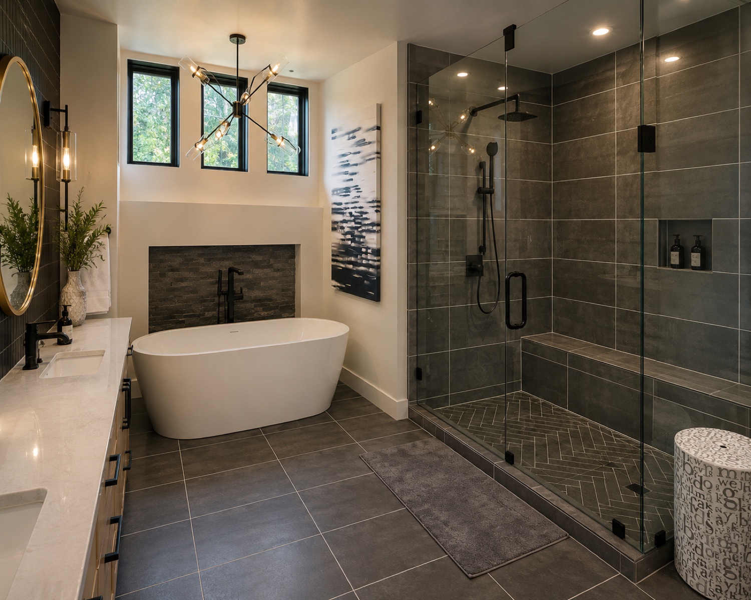 Modern primary bath with freestanding tub, dark tile, glass shower, and warm lighting